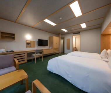 Twin beds with seating area at Kotan Ureshino ryokan, Ureshino Onsen Saga
