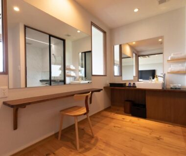 Wooden vanity and dressing area with stool, mirrors and sink in Miyajima Hanare no Yado IBUKU, Hiroshima
