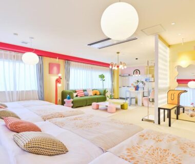 Colorful multi-bed sleeping area with play space at TORA HOTEL Okachimachi in Tokyo