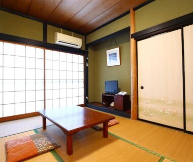 Traditional tatami room with low table, shoji screens and sliding fusuma at Fujimi Sansō, Shizuoka, Chūbu, Japan