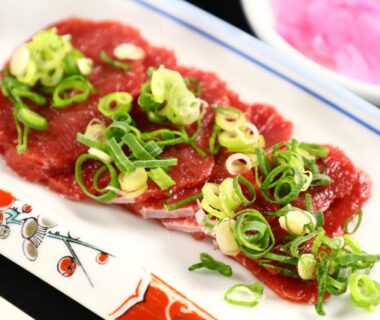 Sliced raw meat garnished with green onions at Fujimi Sansō in Shizuoka, Chūbu, Japan