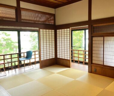 Traditional tatami room with shoji screens and balcony at Yamashiroya Resort in Nagano