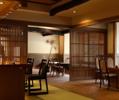 Interior seating area with wooden lattice partitions at Keikoku no Yu in Nagano, Chūbu region