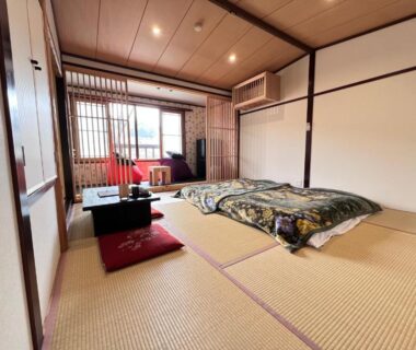 Tatami room with futon and low table at Ōgi-sō, Ōgi Onsen, Kumamoto