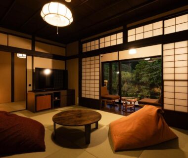 Tatami room with low round table and shoji screens at Ryoan Kawaki in Nagano, Chūbu, Japan