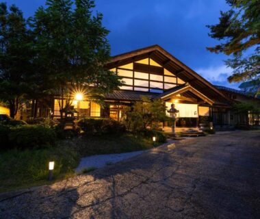 Lit traditional ryokan entrance and garden path at Ryoan Kawaki in Nagano, Chūbu