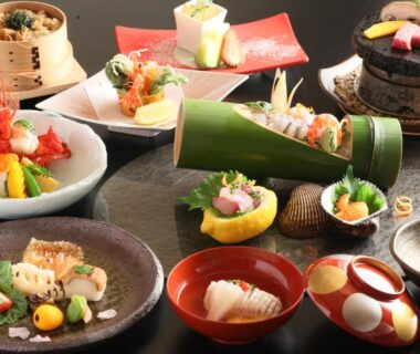 Assortment of small traditional Japanese dishes served on lacquerware at Ryokan Kawana in Chiba