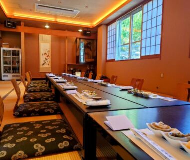 Long tatami dining table with cushions and place settings, Atasawaya Ryokkan, Tokyo, Kantō