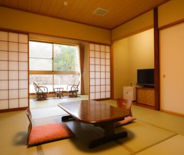Traditional tatami room with low table, shoji screens and balcony seating at Ichinose in Chūbu Shizuoka