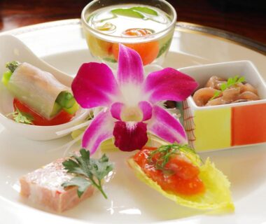 Assorted small Japanese dishes with orchid garnish at Ichinose, Shizuoka, Chūbu