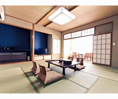 Tatami seating with low table, zabuton cushions and shoji screens at Yuyado Miyuki in Gunma, Kantō, Japan
