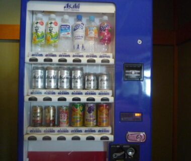 Blue vending machine stocked with canned and bottled drinks at Yushō Fukujikan in Gifu, Chūbu, Japan