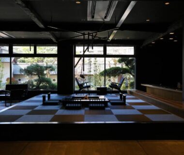 Spacious tatami seating area with low tables and garden views at Oyado Kotobuki, Yumura Onsen, Hyōgo