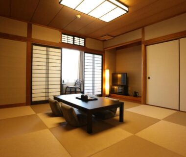 Traditional tatami room with low table and shoji screens at Oyado Kotobuki, Yumura Onsen, Hyōgo