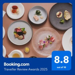 Assorted small plated dishes arranged on table at 源泉掛け流しの宿Albergo湯楽, Kantō, Japan