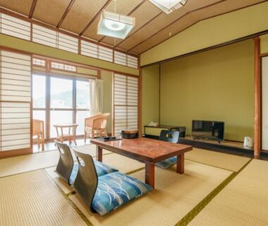 Traditional tatami room with low table, shoji screens and balcony at Shōgetsu, Atami, Shizuoka, Chūbu Japan