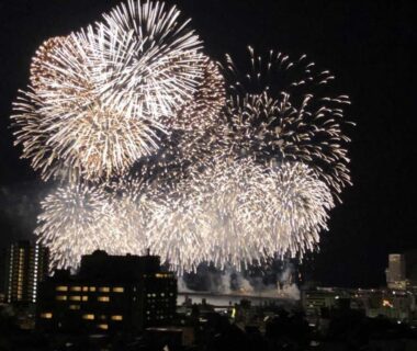 Nighttime fireworks over city skyline near Shōgetsu ryokan, Kinomiya source, Atami, Shizuoka, Chūbu Japan