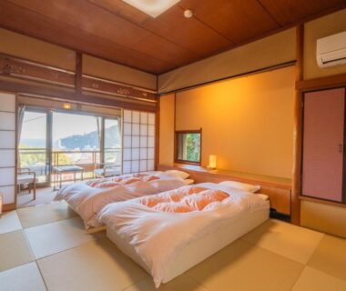 Traditional tatami room with futon beds and shoji screens at Ryokan Hōetsu, Shizuoka