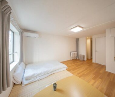 Futon on floor by window with low table, Mizu no Yado Asakusa, Tokyo