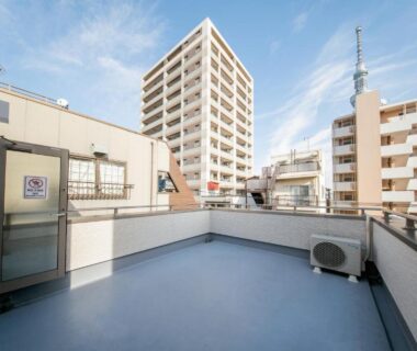Open rooftop terrace with city buildings visible from Mizu no Yado Asakusa in Tokyo