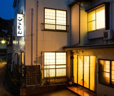 Exterior at dusk with glowing shoji windows and entrance signage at Koemon auberge apaisante in Hyōgo, Kansai