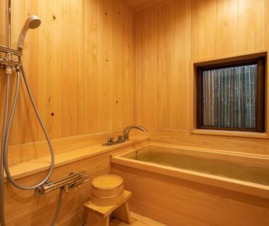 Wooden soaking tub with shower and stool at Kyōka auberge de Gion, Kyoto