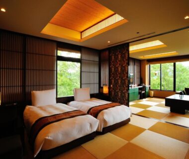 Tatami-style room with twin beds and wooden bath at Chikusenso Onsen Miyagi Tōhoku