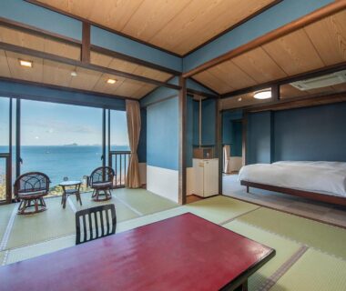 Tatami room with sea view, low table and bed, Shinpachiya ryokan in Mie, Kansai
