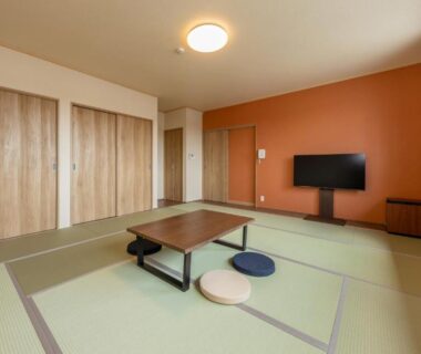 Tatami room with low table and floor cushions at Isamiya auberge du voyage et de la découverte in Fukushima, Tōhoku