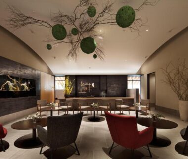 Ryokan lounge with circular chairs, low tables, hanging green decor and reception at Nasu Muku no Ne, Tochigi