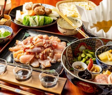 Assorted Japanese dishes and small bowls on wooden tray at koden ryokan Hyōgo