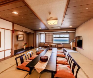 Spacious tatami dining room with low table and cushions at Choshi Grand Hotel in Chiba