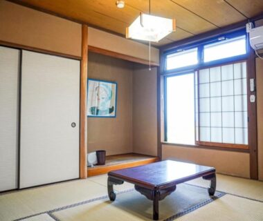 Traditional tatami room with low table and shoji at Abekura Onsen in Kanagawa