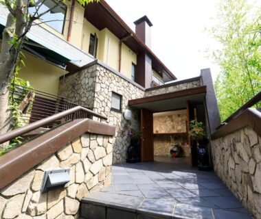 Stone-lined entrance with wooden walkway at Miyabitake in Kanagawa Kanto