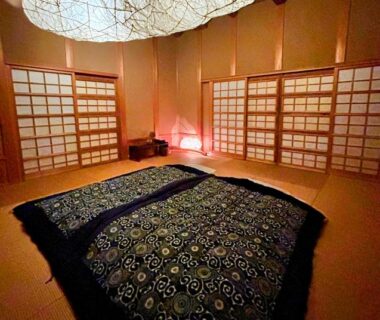 Tatami room with futon, shoji screens and hanging paper lantern at Kaze no Sawa Miyagi Tōhoku