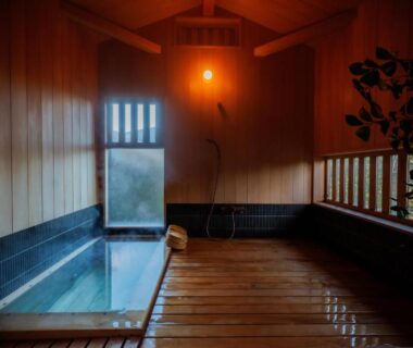 Small indoor onsen bath with wooden interior at Kaze no Sawa in Miyagi, Tōhoku, Japan