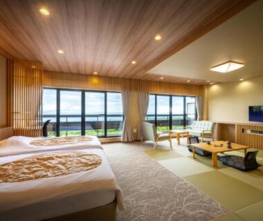 Spacious tatami room with twin beds and low table at Kagetsu Highland Hotel, Takayu Onsen, Fukushima