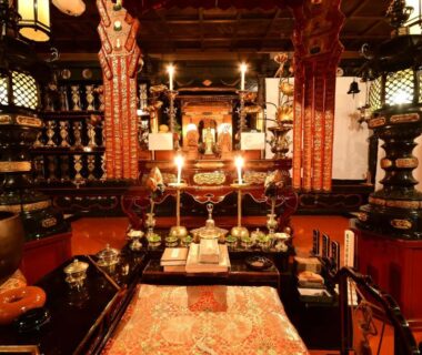 Ornate altar with lanterns, candles and ritual objects inside Sanboin shukubo at Koyasan, Wakayama