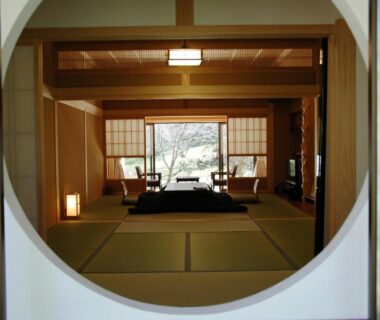Circular doorway opening to tatami room with low table and shoji screens at Koyasan Shukubo Fudoin Wakayama