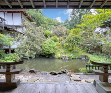 Tranquil pond courtyard viewed from wooden veranda at Koyasan Komyoin Wakayama