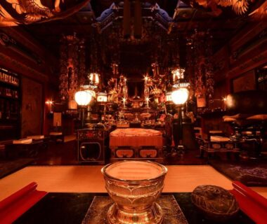 Ornate Buddhist altar room with hanging lanterns and tatami at Daienin Shukubo Koyasan Wakayama