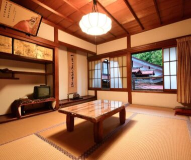 Tatami room with low wooden table, shoji screens, vaulted ceiling, courtyard view at Koyasan Shukubo Daimyououin Wakayama