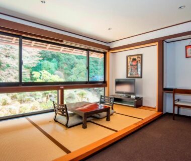 Tatami seating with low table and large window overlooking garden at Koyasan Shukubo Fumonin, Wakayama, Kansai