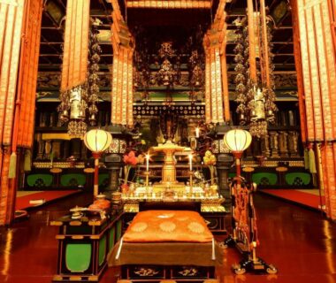 Gold Buddhist altar and ornate pillars inside temple hall at Koyasan Shukubo Sojiin Wakayama