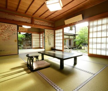Sunlit tatami room with low table, shoji screens and garden view at Koyasan Shukubo Sojiin Wakayama